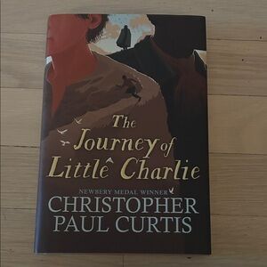 Scholastic - The Journey of Little Charlie - Brown and Red Cover